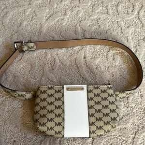 Michael Kors brown, tan, and white waist purse.